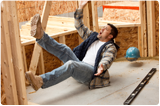 A man on a construction site is falling which makes the subject quite blurred