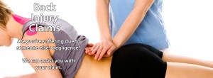 An image of a woman lying on her front getting a massage in her lower back