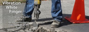 An image of a man digging a hole in the road with a jackhammer