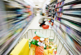 picture of a shopping trolley traveling at speed down an aisle