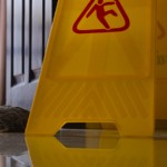 hazard sign next to a mop