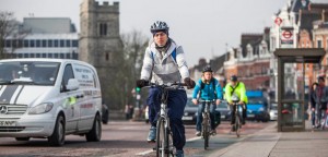 a picture of a man on a bike in london